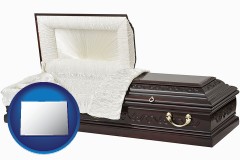 colorado map icon and an open funeral casket