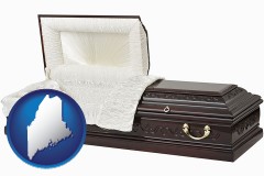 maine map icon and an open funeral casket