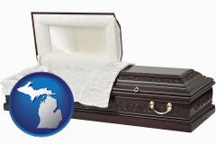michigan map icon and an open funeral casket