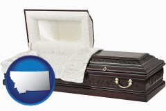 montana map icon and an open funeral casket