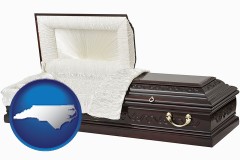 north-carolina map icon and an open funeral casket