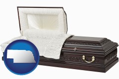 nebraska map icon and an open funeral casket