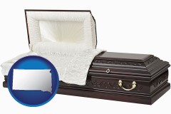 south-dakota map icon and an open funeral casket