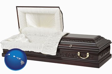 an open funeral casket - with Hawaii icon