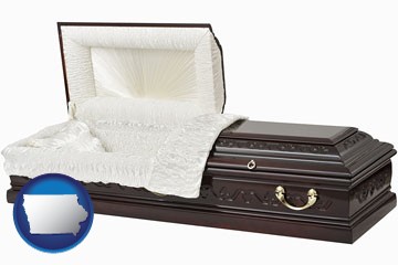 an open funeral casket - with Iowa icon