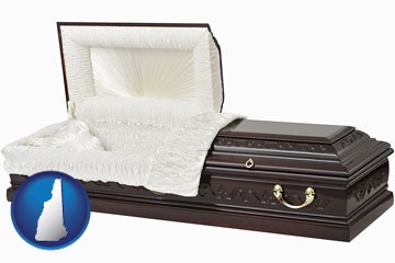 an open funeral casket - with New Hampshire icon