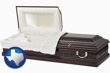 an open funeral casket - with Texas icon